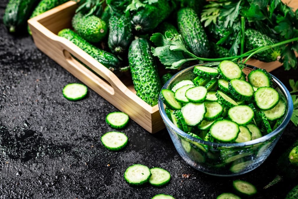 Full glass bowl of chopped fresh cucumbers.